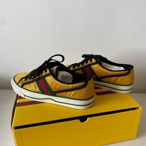 Gucci Gold and Black Low-Top Sneakers